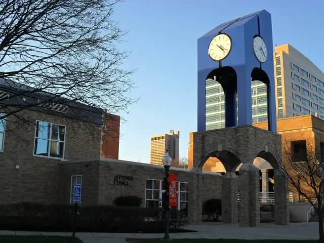 Franklin University campus — Franklin University Clock Tower, with Fisher Hall and Partial Columbus Skyline in Background. Columbus, Ohio, USA.